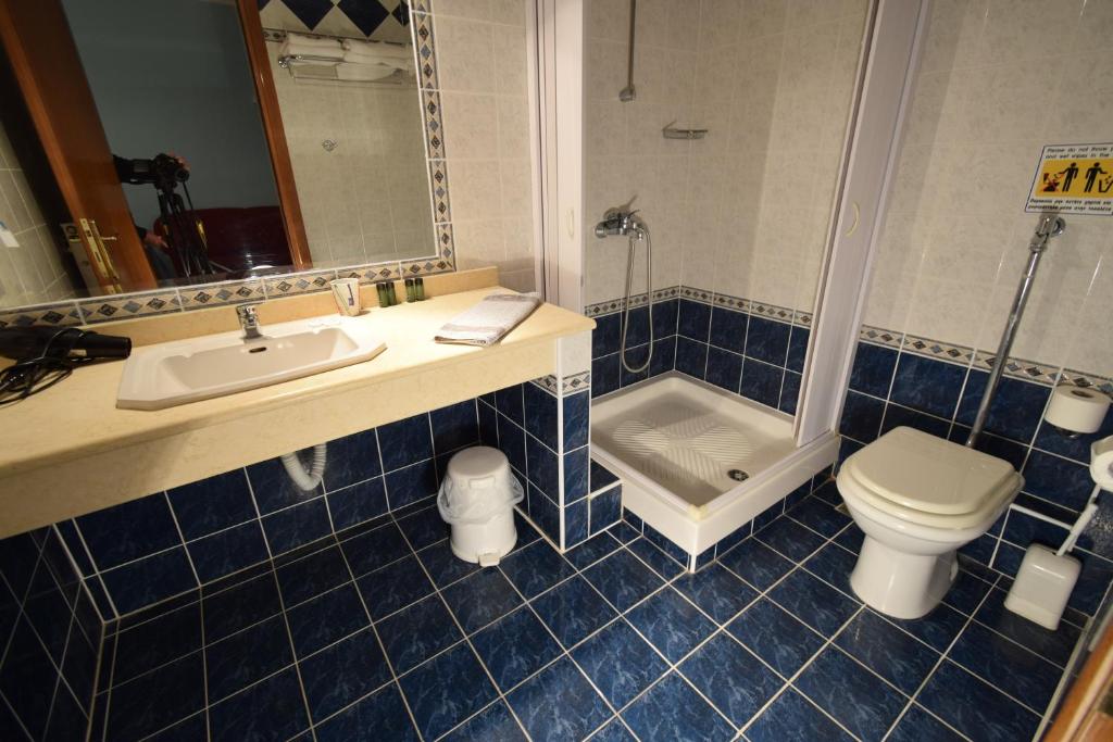 Koupelna v ubytování Hotel Aperio