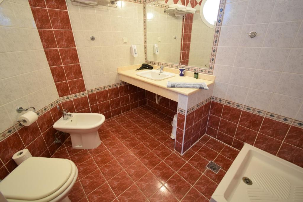 Koupelna v ubytování Hotel Aperio
