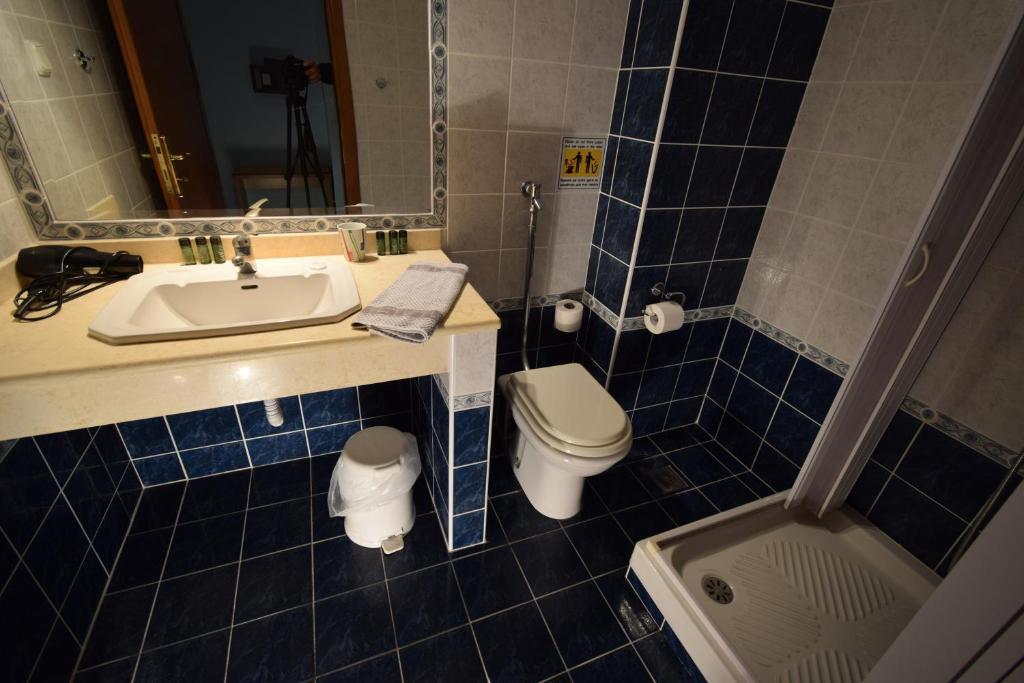 Koupelna v ubytování Hotel Aperio