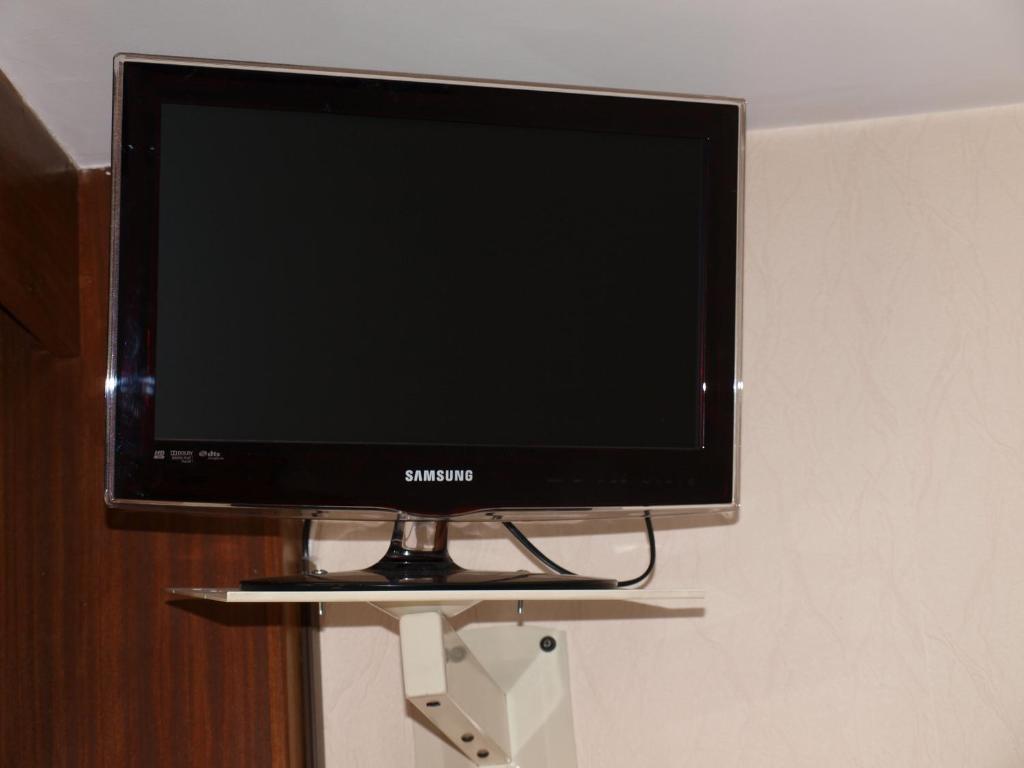 TV a/nebo společenská místnost v ubytování Atmosphere Hotel