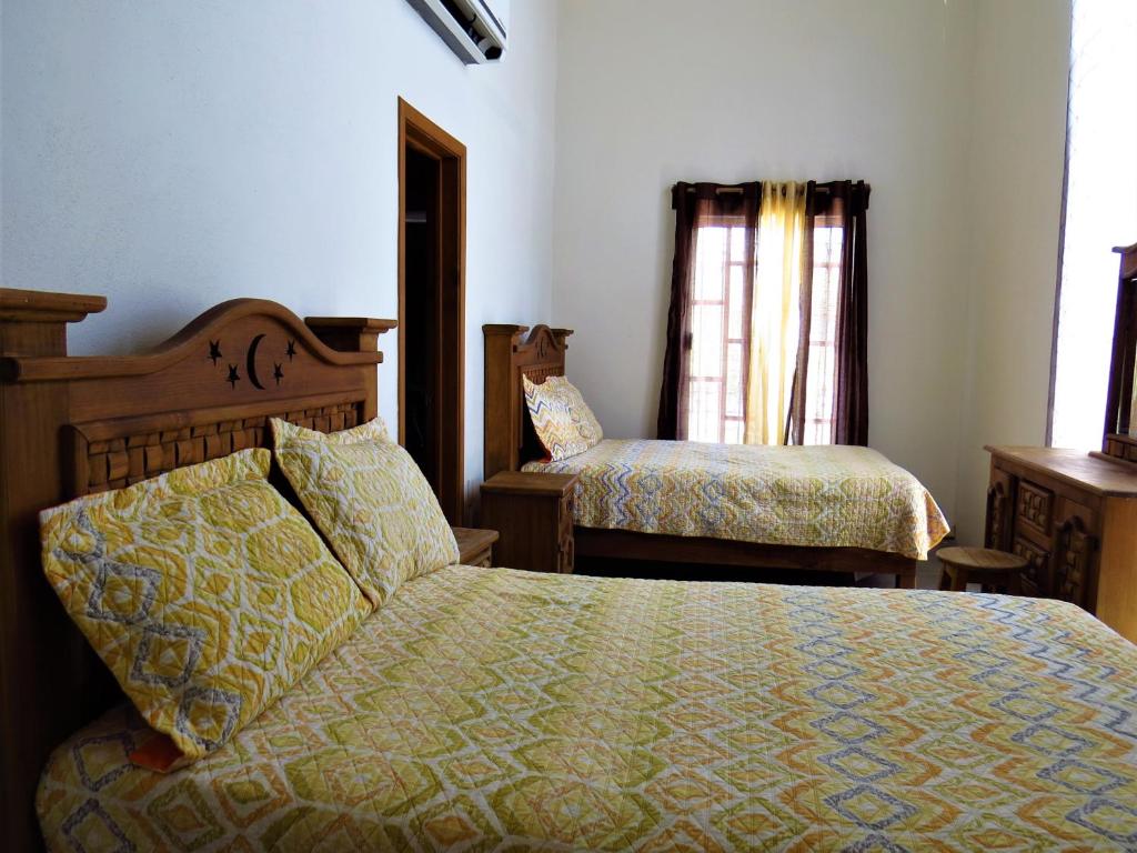 Postel nebo postele na pokoji v ubytování Hotel Purisima Concepción