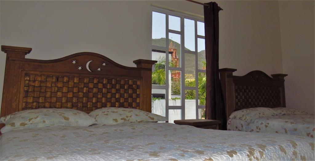 Postel nebo postele na pokoji v ubytování Hotel Purisima Concepción