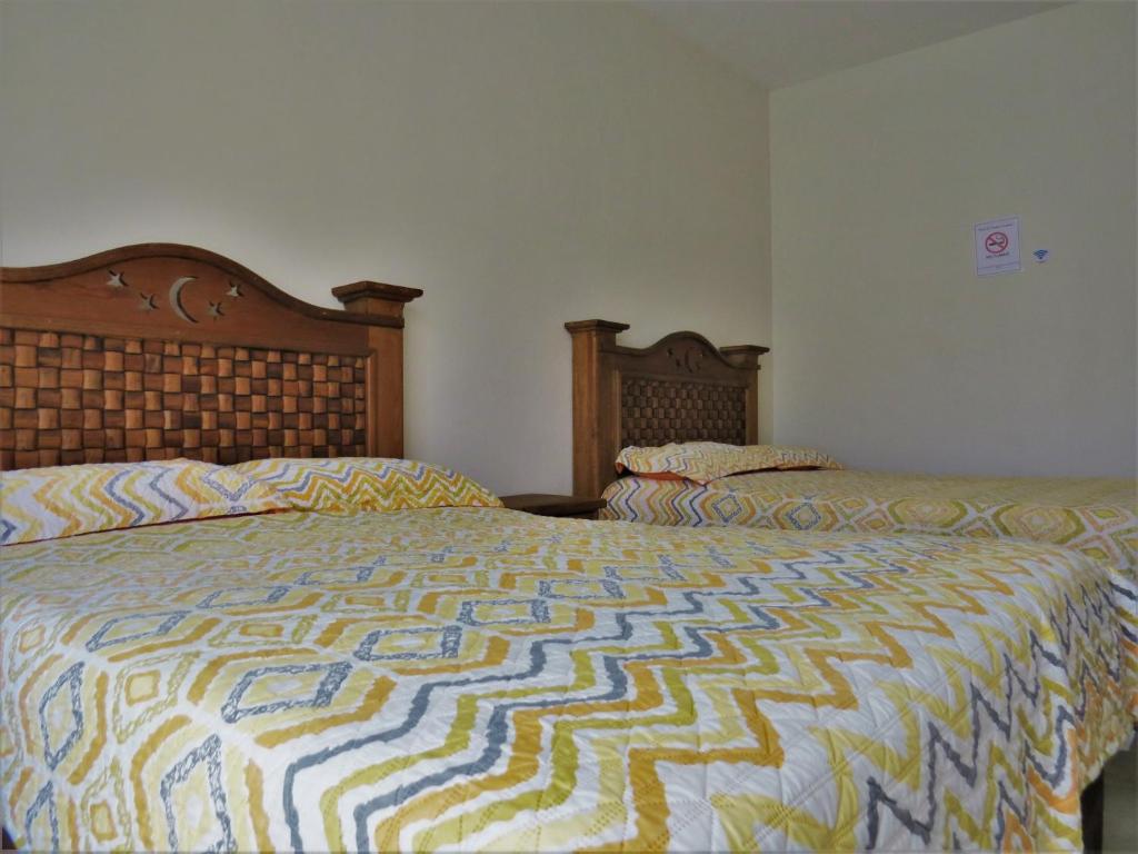 Postel nebo postele na pokoji v ubytování Hotel Purisima Concepción
