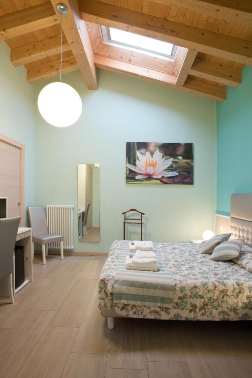 Łóżko lub łóżka w pokoju w obiekcie B&B La Casa di Rosa