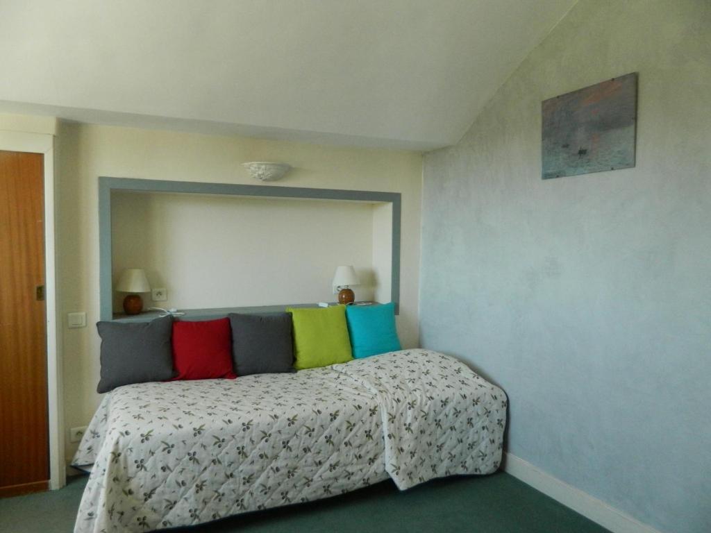 Postel nebo postele na pokoji v ubytování Hôtel La Caravelle