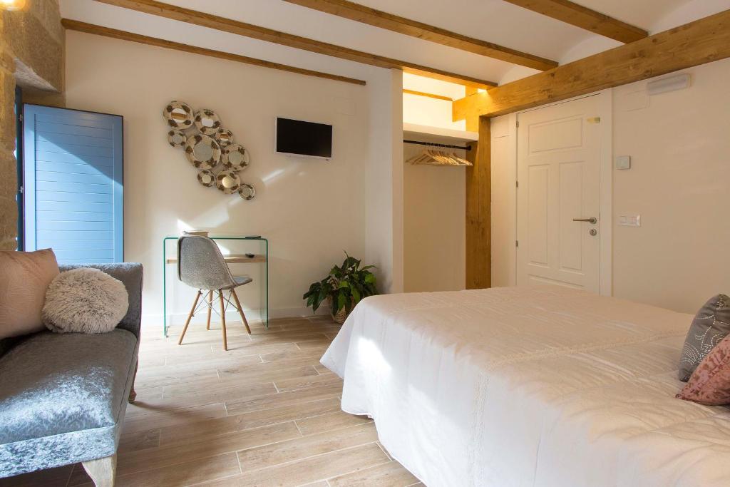 A bed or beds in a room at El Mirador de Eloísa