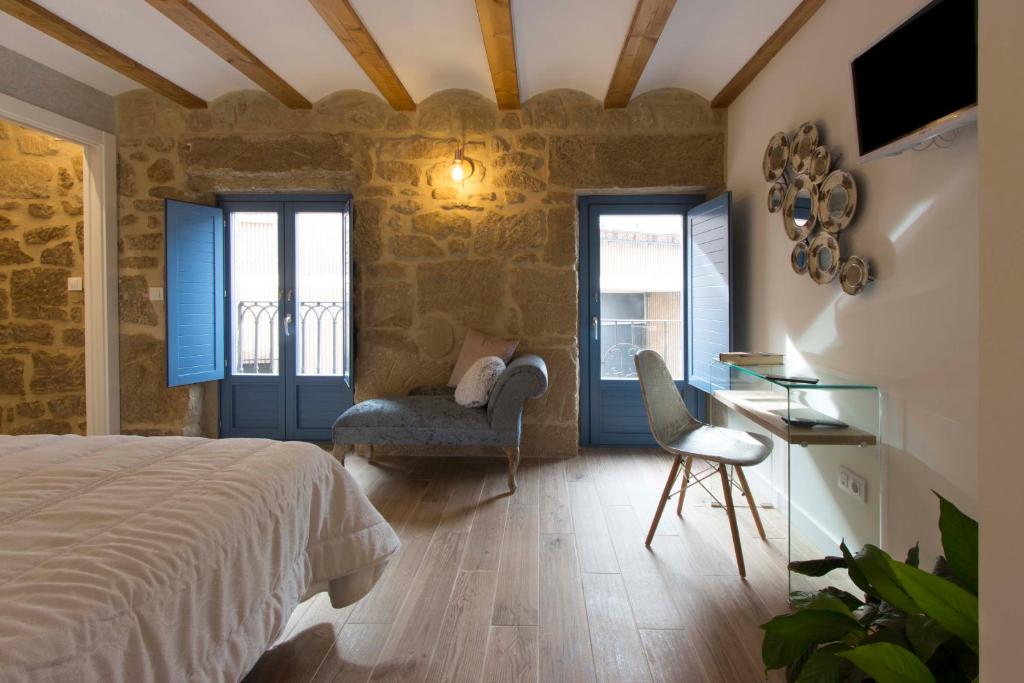 A bed or beds in a room at El Mirador de Eloísa