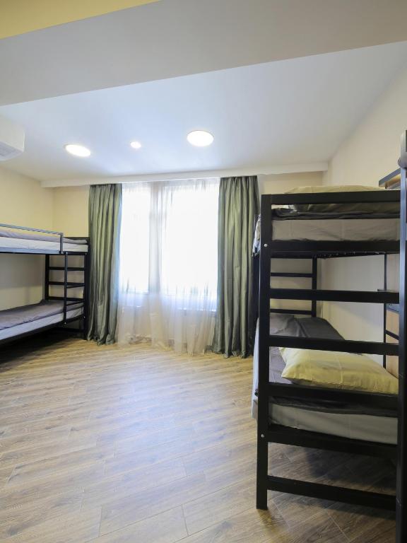 Postel nebo postele na pokoji v ubytování Highland Hostel