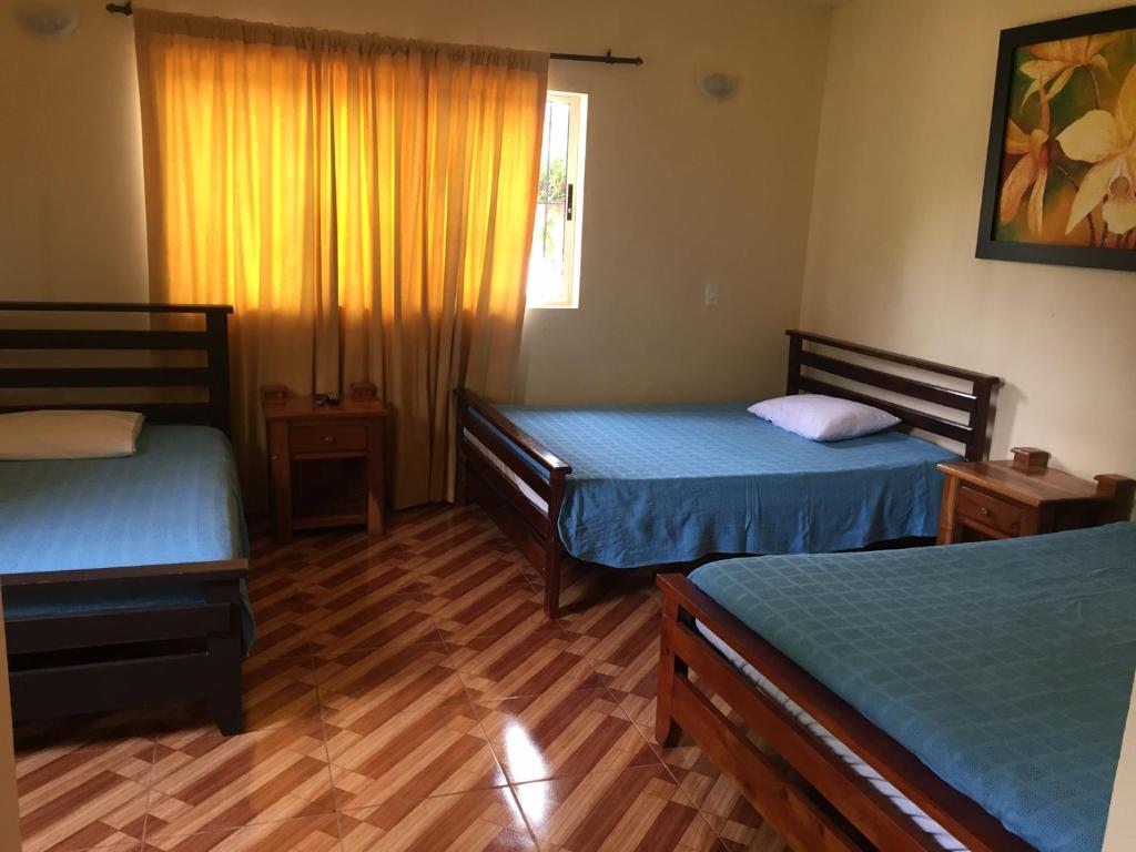 Postel nebo postele na pokoji v ubytování Finca Hotel La Ponderosa