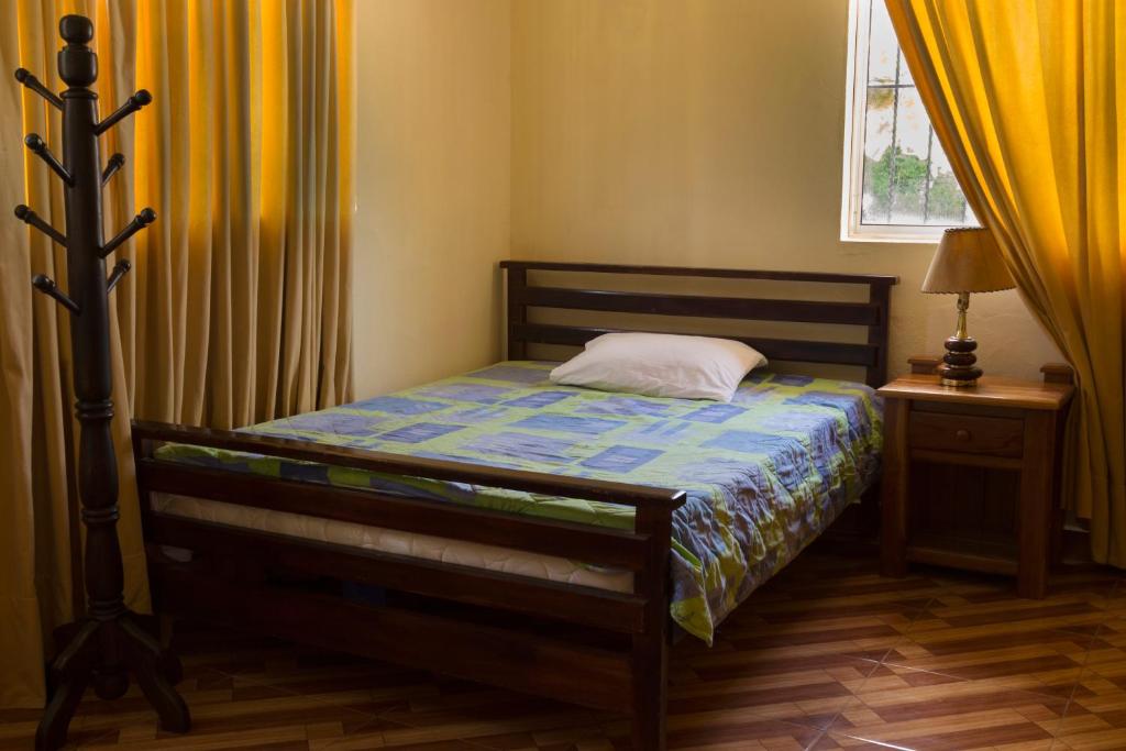 Postel nebo postele na pokoji v ubytování Finca Hotel La Ponderosa