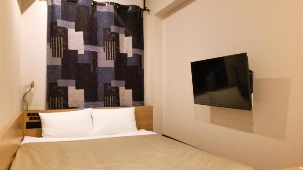 TV a/nebo společenská místnost v ubytování Sakura Terrace The Atelier