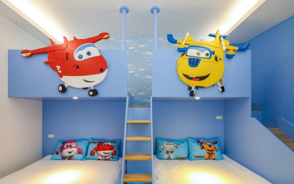 A bed or beds in a room at Wujie Childlike B&B