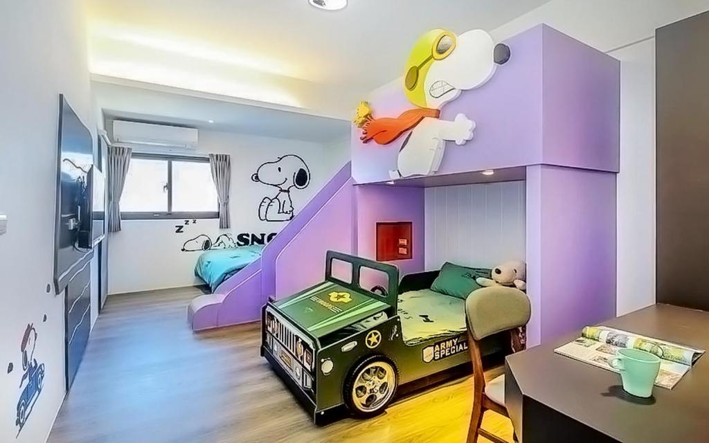 A bed or beds in a room at Wujie Childlike B&B