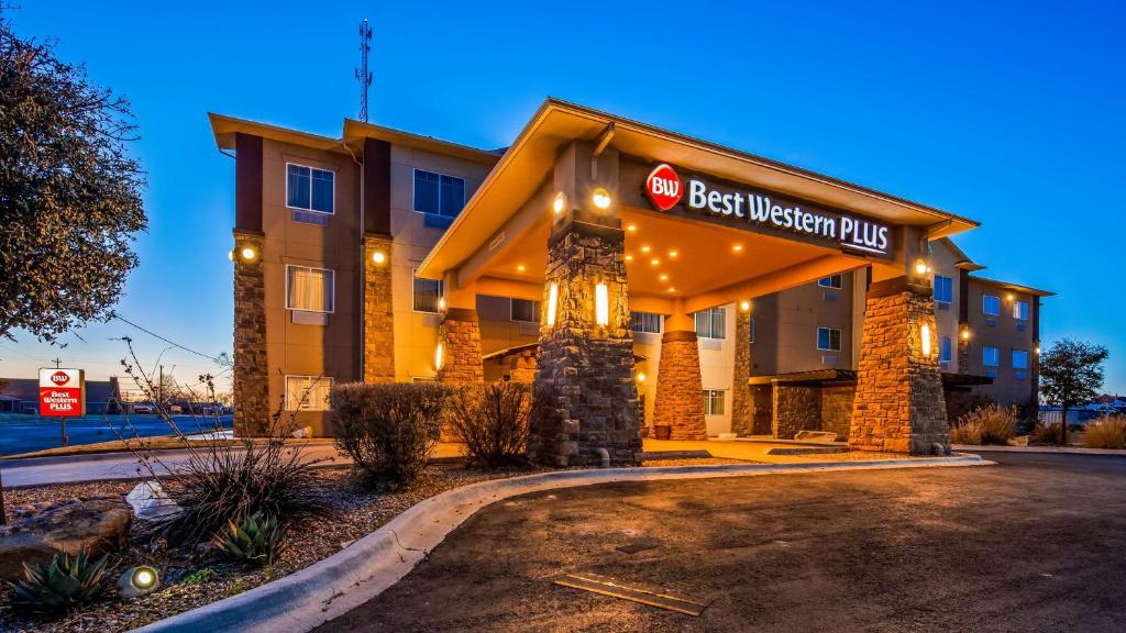 a hotel with a sign that reads best western plus at Best Western Plus Seminole Hotel & Suites in Seminole