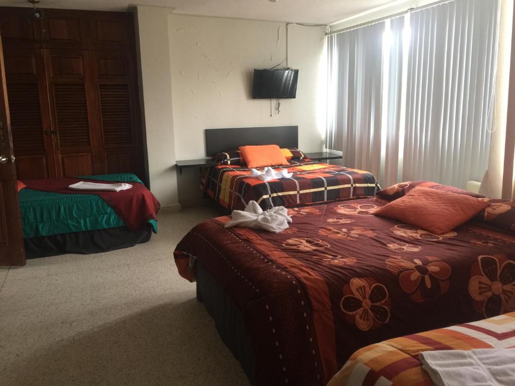 Postel nebo postele na pokoji v ubytování G y V Hotels