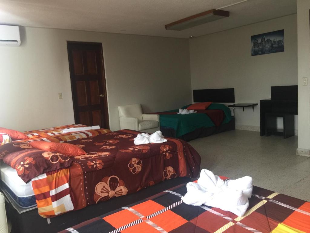Postel nebo postele na pokoji v ubytování G y V Hotels