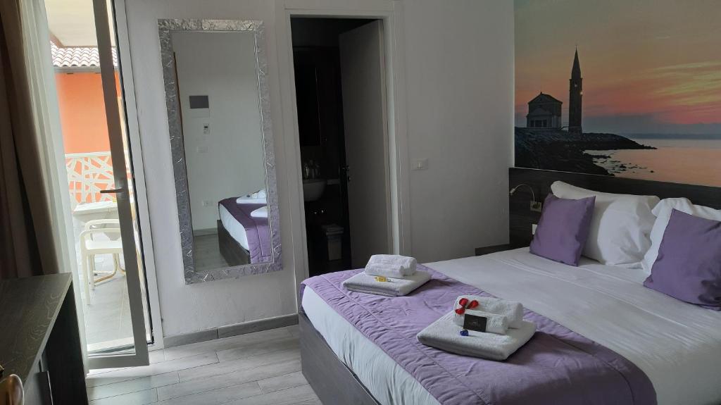 Postel nebo postele na pokoji v ubytování Hotel Tre Rose