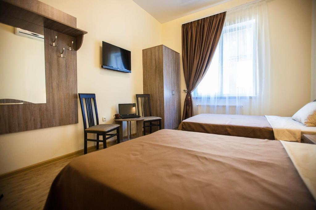 Postel nebo postele na pokoji v ubytování Arnautskiy Hotel