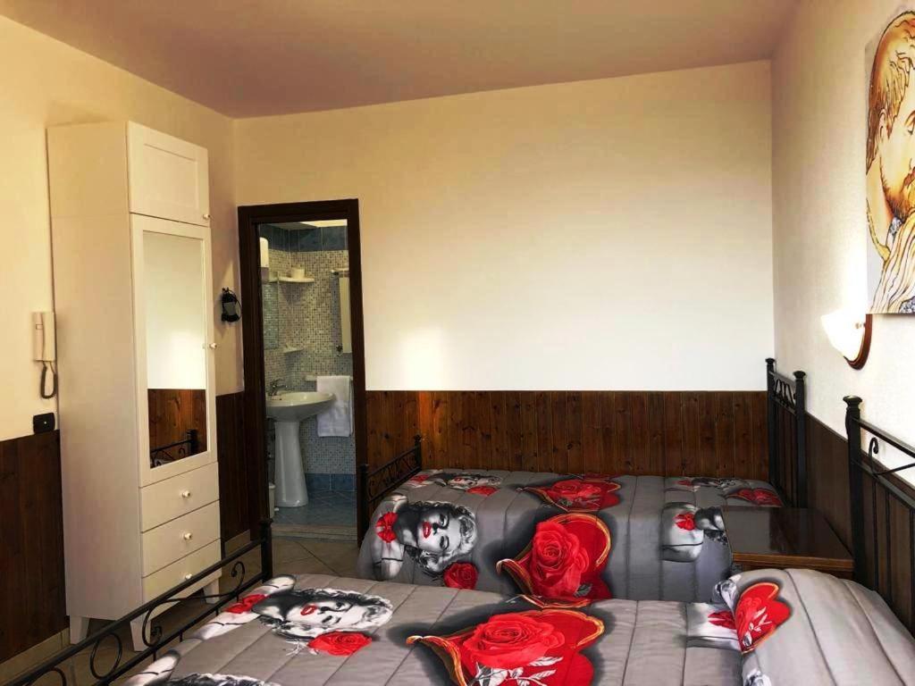Postel nebo postele na pokoji v ubytování Camere Sul Mare
