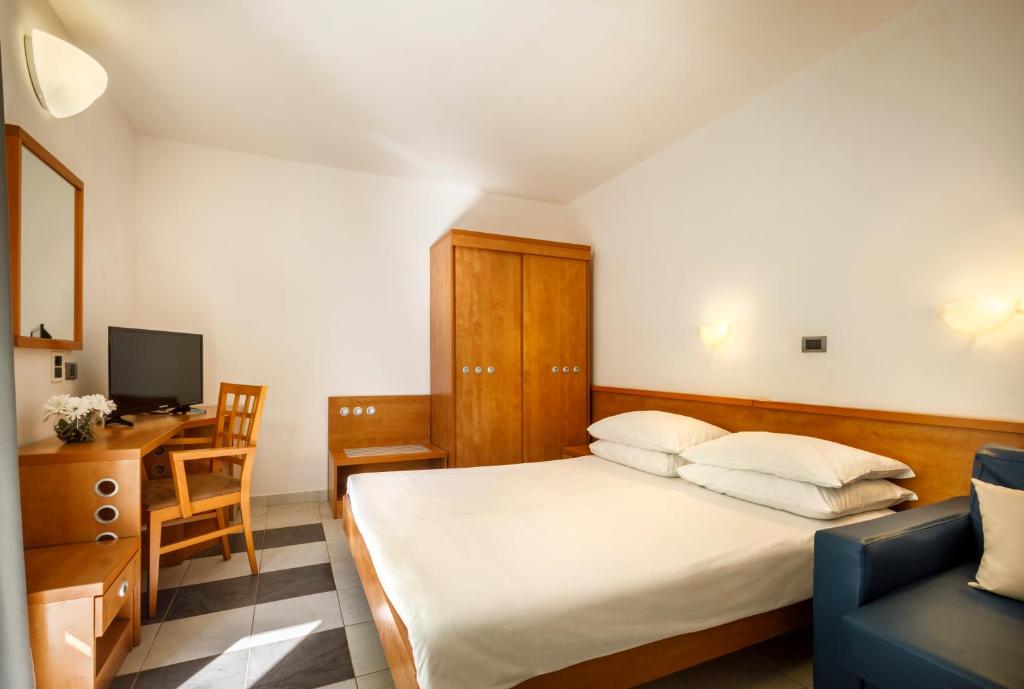 Postel nebo postele na pokoji v ubytování Maistra Select Amarin Resort