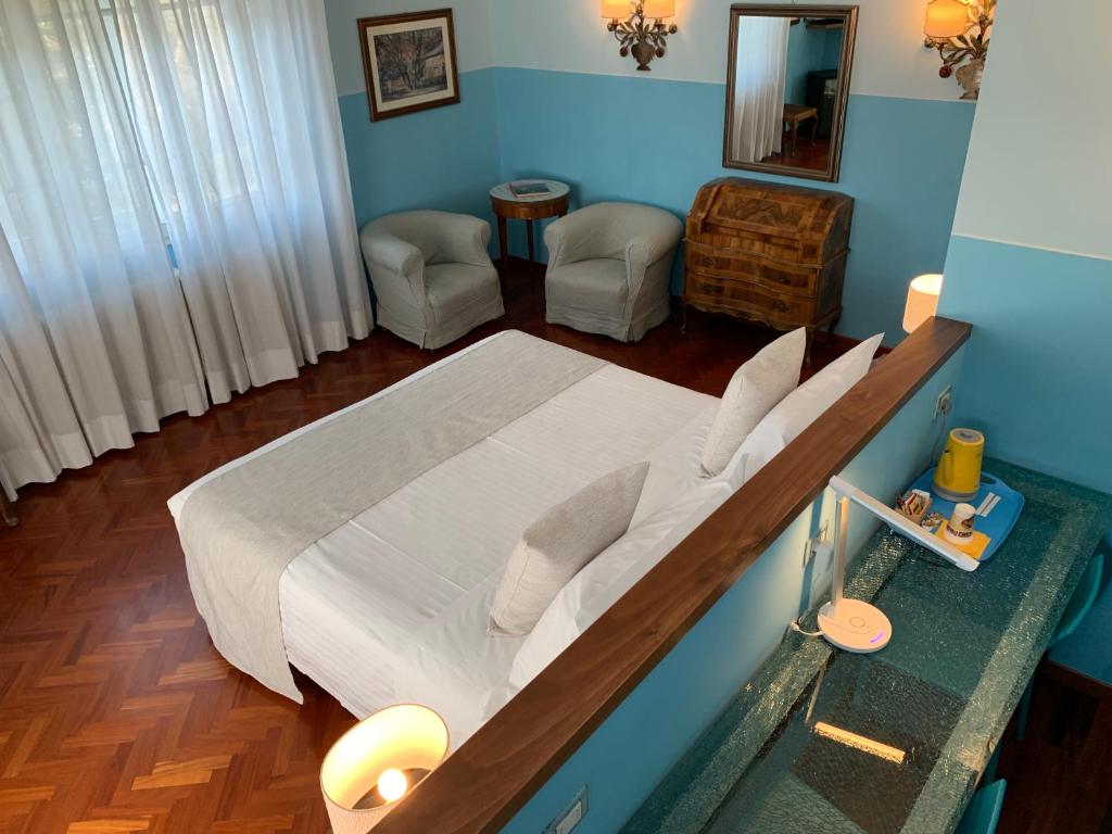 Postel nebo postele na pokoji v ubytování Hotel David
