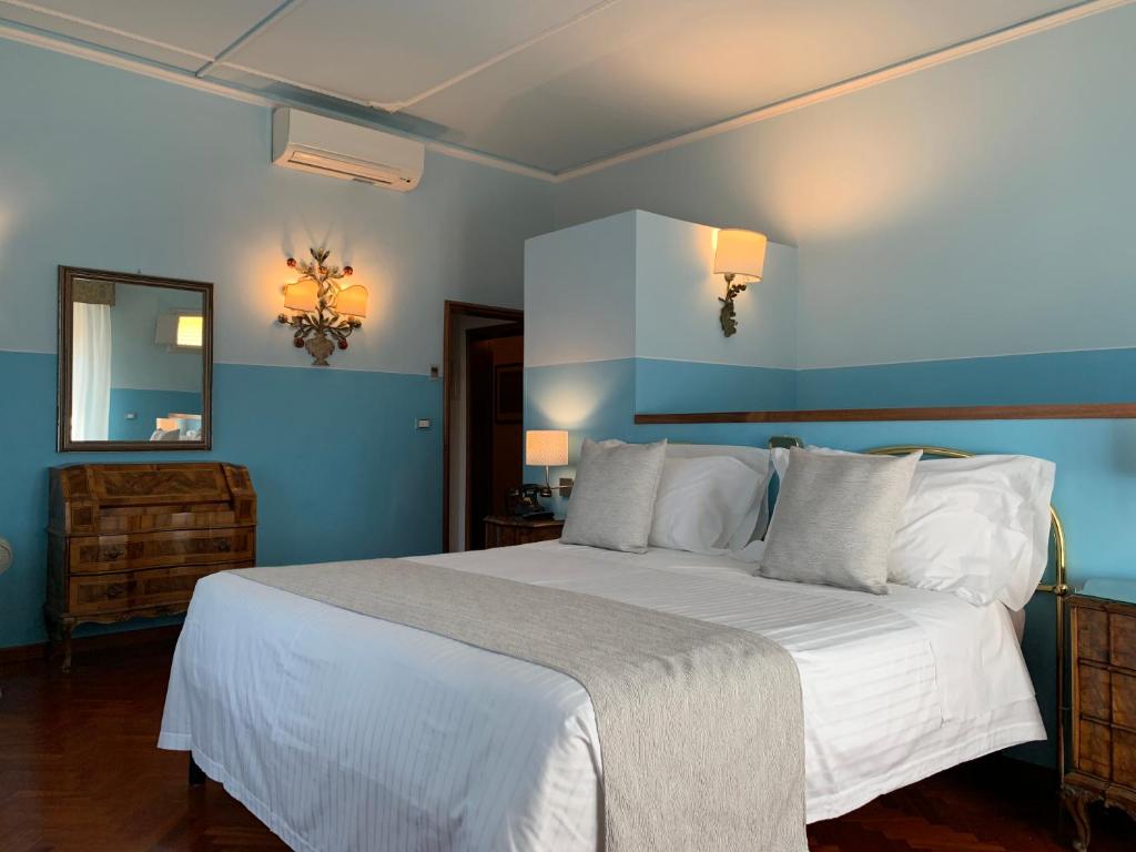 Postel nebo postele na pokoji v ubytování Hotel David