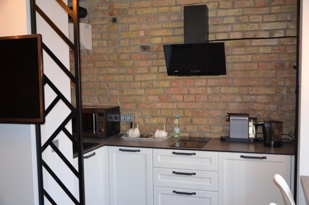 Kuchyň nebo kuchyňský kout v ubytování StanGret Hotel