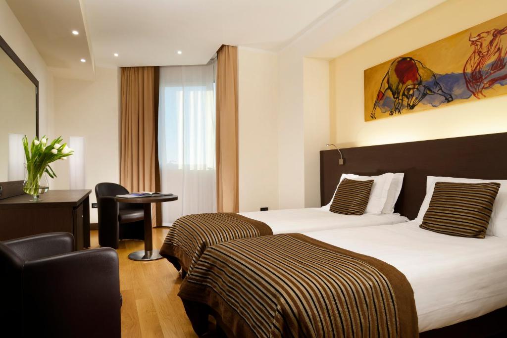 Posteľ alebo postele v izbe v ubytovaní Hotel Diamante