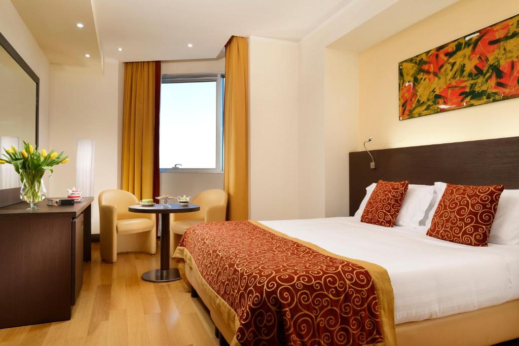 Posteľ alebo postele v izbe v ubytovaní Hotel Diamante