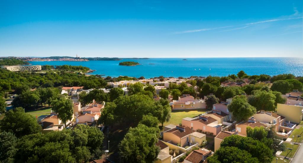 an aerial view of a residential suburb with the ocean at Maistra Select Amarin Resort in Rovinj