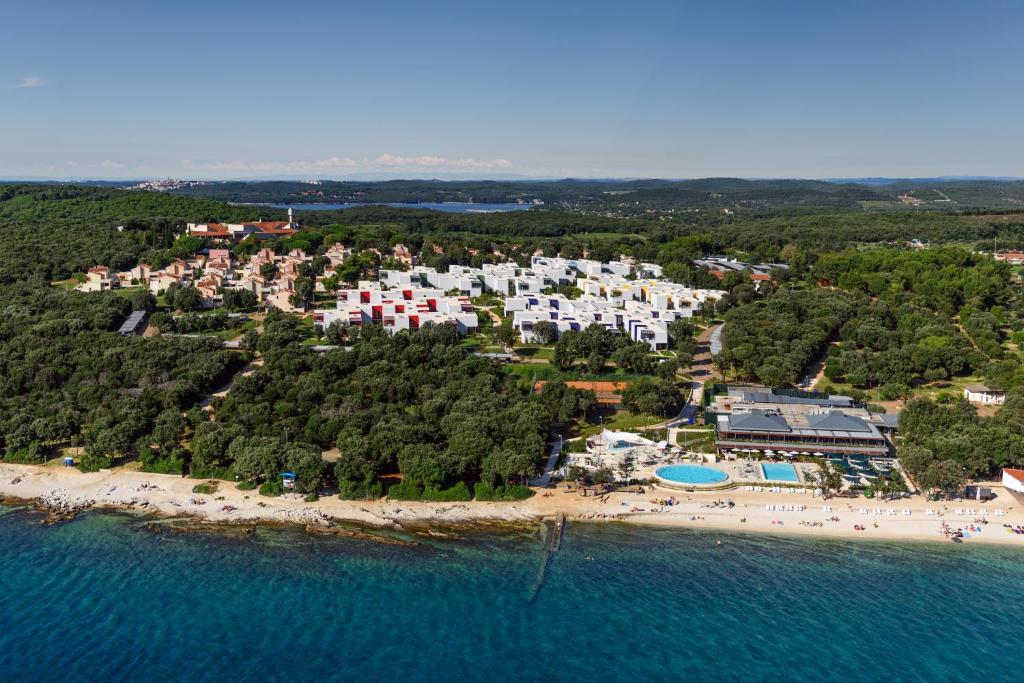 
a large body of water with houses and buildings at Apartments Amarin in Rovinj

