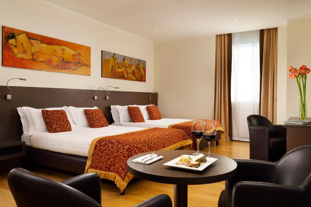 Posteľ alebo postele v izbe v ubytovaní Hotel Diamante