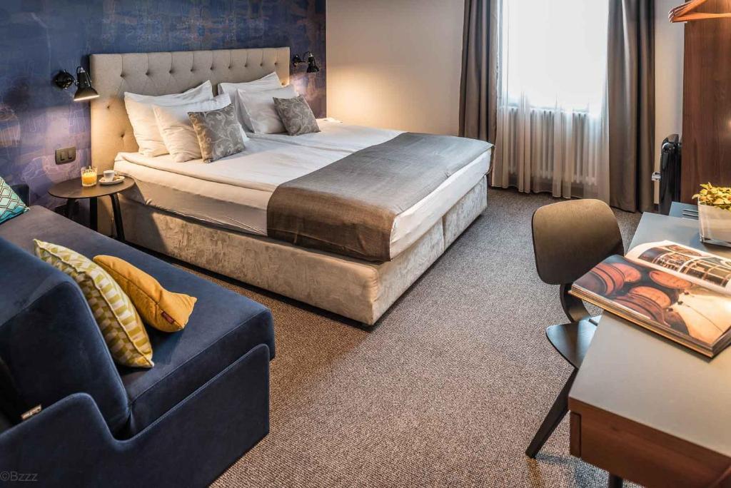 Postel nebo postele na pokoji v ubytování Hotel Mrak