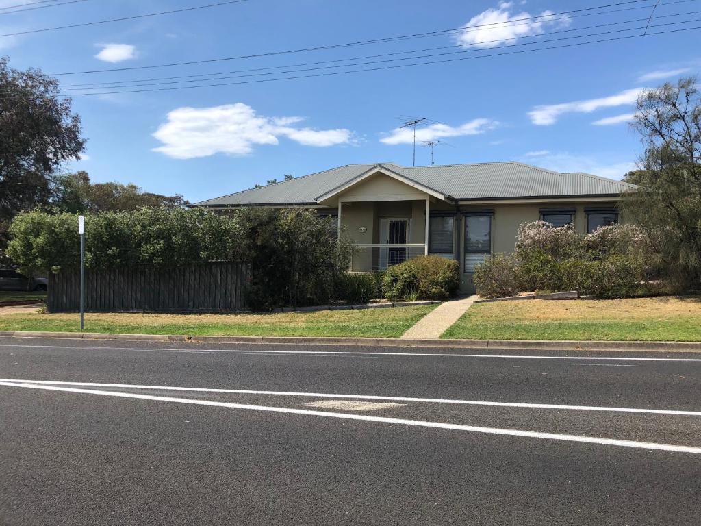 a house on the side of the road at Seagrape Cottage in Ocean Grove