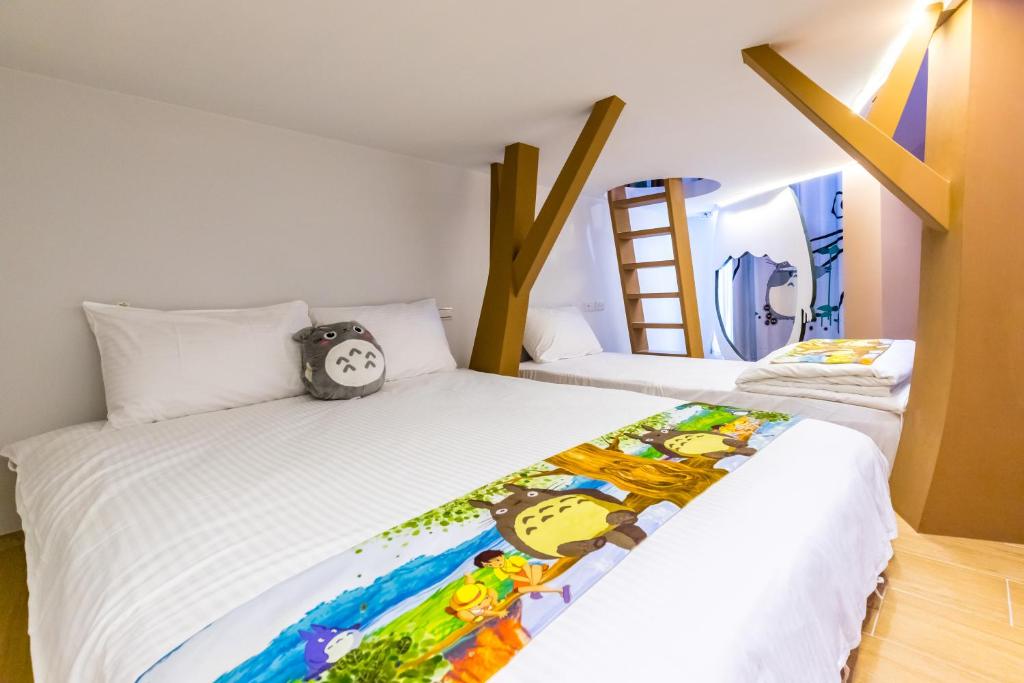 Postel nebo postele na pokoji v ubytování 松楓親子民宿Songfeng Family B&B
