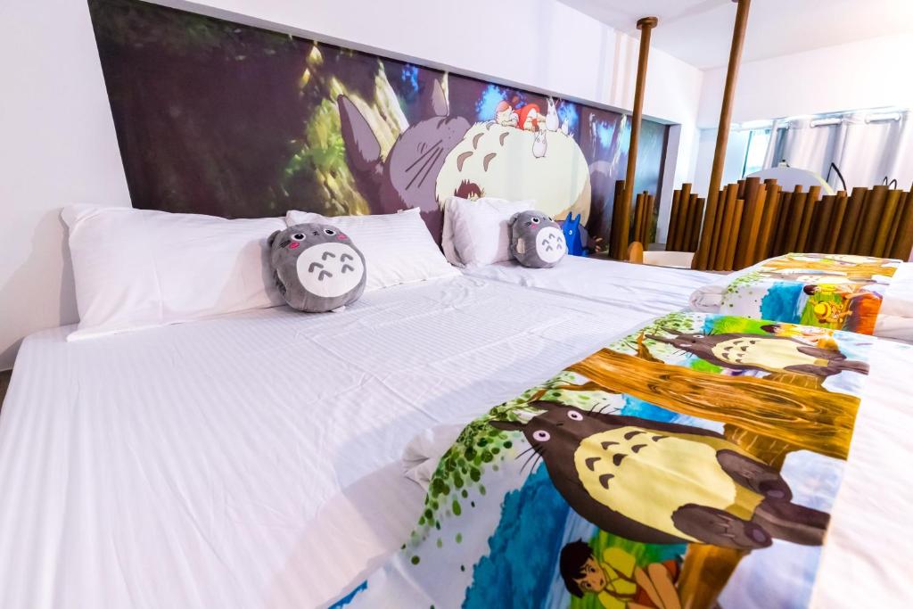 Postel nebo postele na pokoji v ubytování 松楓親子民宿Songfeng Family B&B