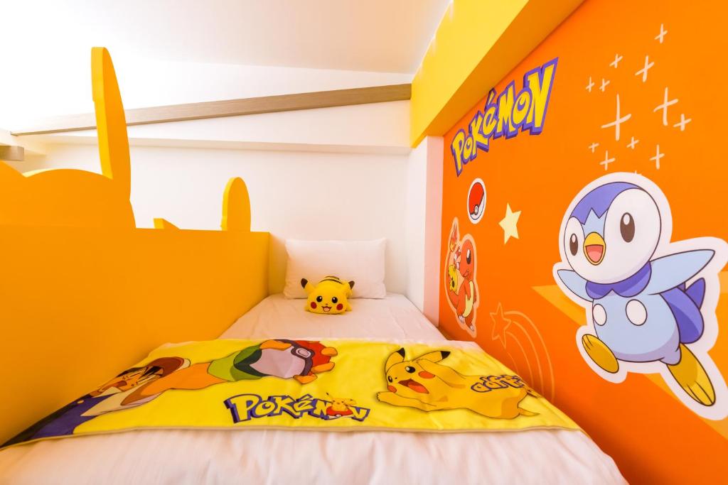 Postel nebo postele na pokoji v ubytování 松楓親子民宿Songfeng Family B&B