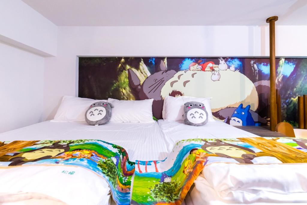Postel nebo postele na pokoji v ubytování 松楓親子民宿Songfeng Family B&B