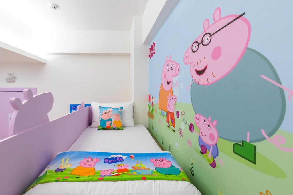 Postel nebo postele na pokoji v ubytování 松楓親子民宿Songfeng Family B&B