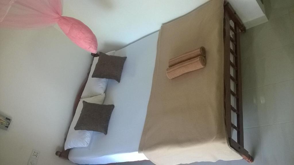 Postel nebo postele na pokoji v ubytování Ella Breeze Homestay