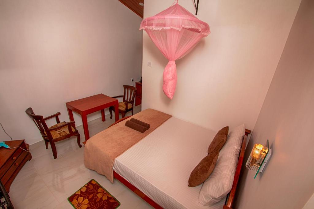 Postel nebo postele na pokoji v ubytování Ella Breeze Homestay
