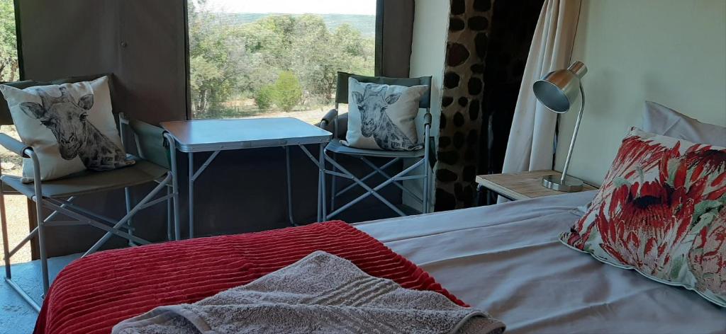 Postel nebo postele na pokoji v ubytování Shamba Yetu Mountain Lodge