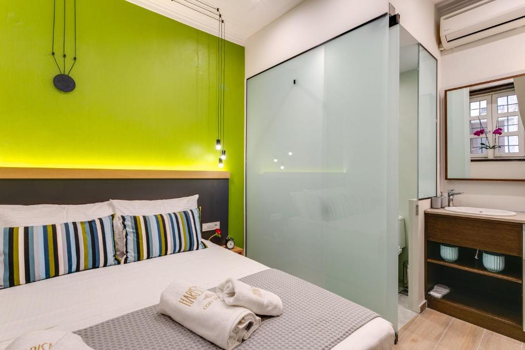 Postel nebo postele na pokoji v ubytování Harismari Cozy Hotel
