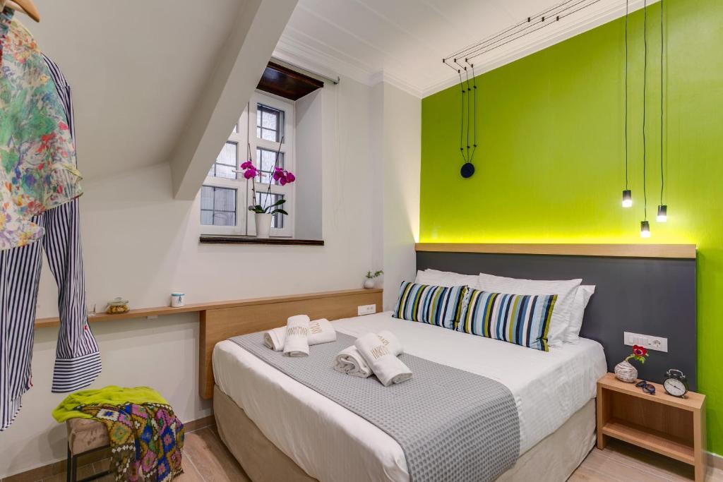 Postel nebo postele na pokoji v ubytování Harismari Cozy Hotel