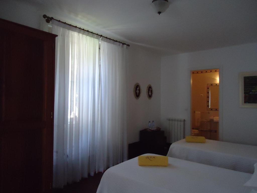 Postel nebo postele na pokoji v ubytování Quinta do Vale do Monte