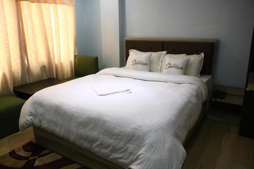 Postel nebo postele na pokoji v ubytování Hotel Samrajya Pvt. Ltd.