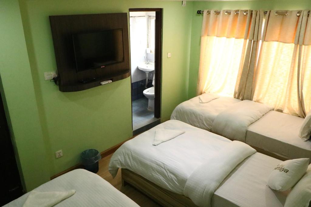 Postel nebo postele na pokoji v ubytování Hotel Samrajya Pvt. Ltd.