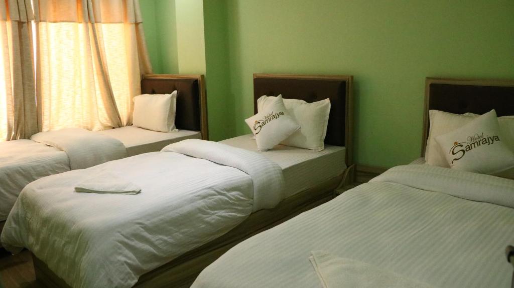 Postel nebo postele na pokoji v ubytování Hotel Samrajya Pvt. Ltd.
