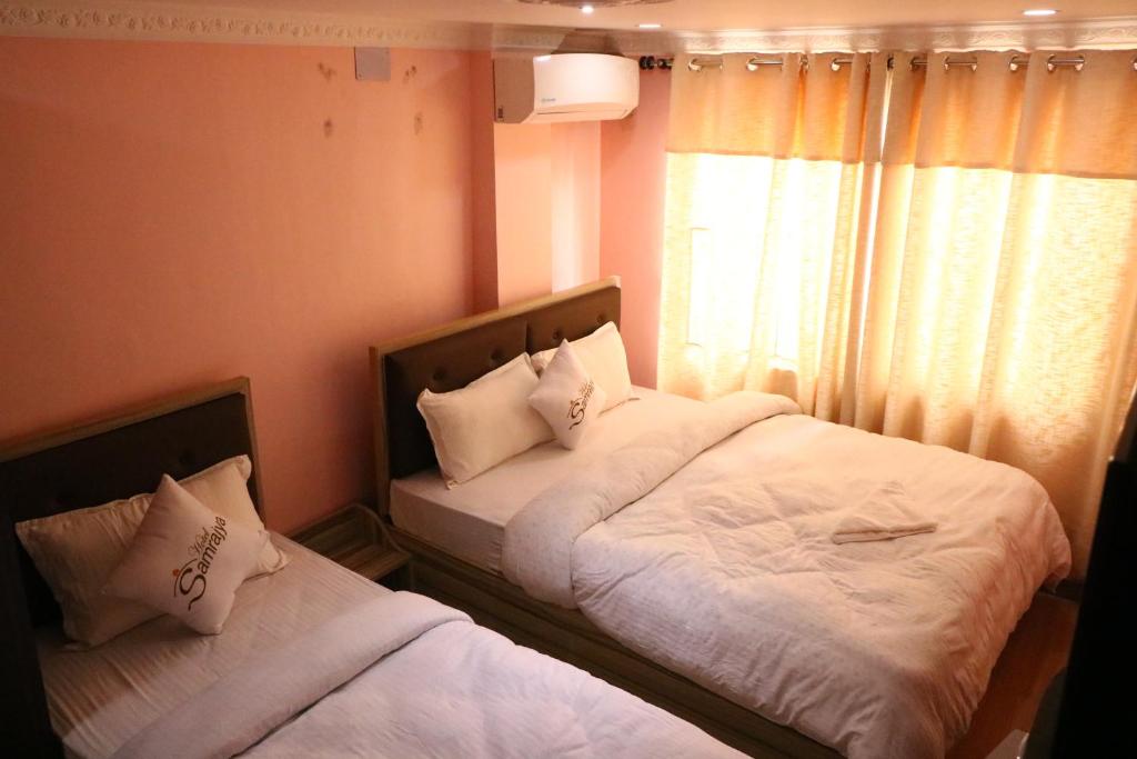 Postel nebo postele na pokoji v ubytování Hotel Samrajya Pvt. Ltd.