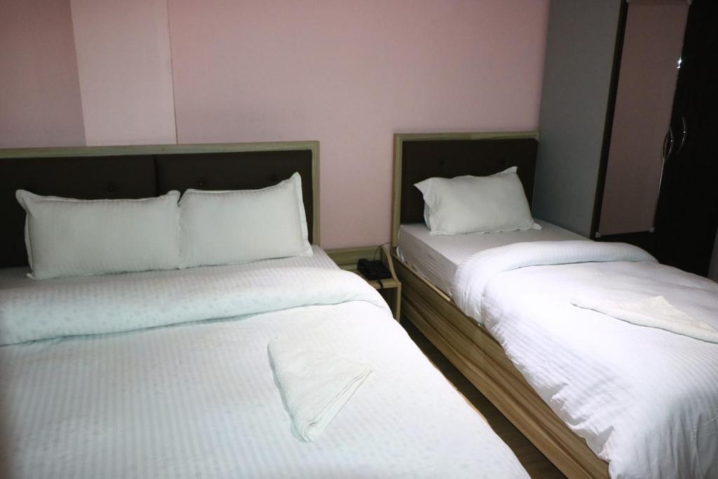 Postel nebo postele na pokoji v ubytování Hotel Samrajya Pvt. Ltd.